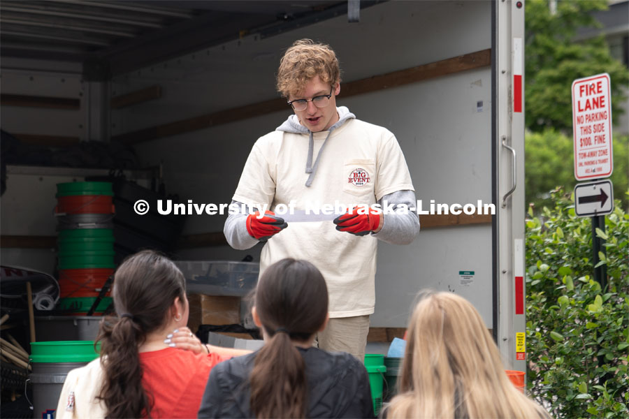 Paul Pechous reads off a list of gear to be handed out to a Big Event volunteer group. May 4, 2024. Photo by Kirk Rangel for University Communication.